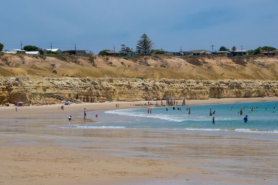 View of Port Willunga beach with holiday makers enjoying the summer day 