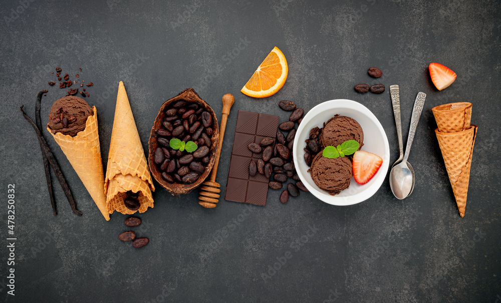 Poster chocolate ice cream flavours in bowl with dark chocolate and cacao nibs setup on dark stone backgrou