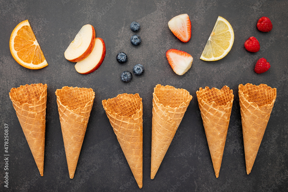 Aufkleber flat lay ice cream cones collection on dark stone background . blank crispy ice cream cone with copy