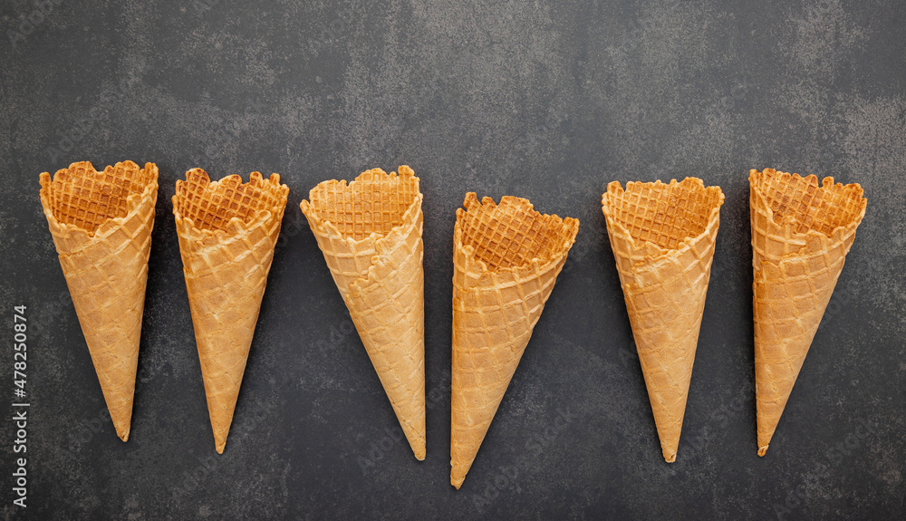 Aufkleber flat lay ice cream cones collection on dark stone background . blank crispy ice cream cone with copy