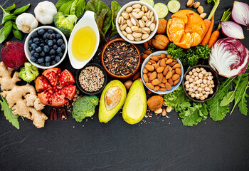 Ingredients for the healthy foods selection. The concept of healthy food set up on dark stone background. - 478251005