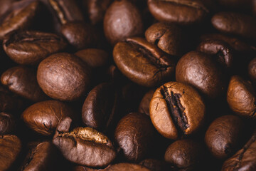 Roasted coffee beans full frame background Close up macro dark brown