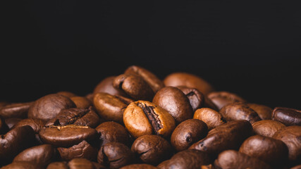 Roasted coffee beans full frame background Close up macro dark brown