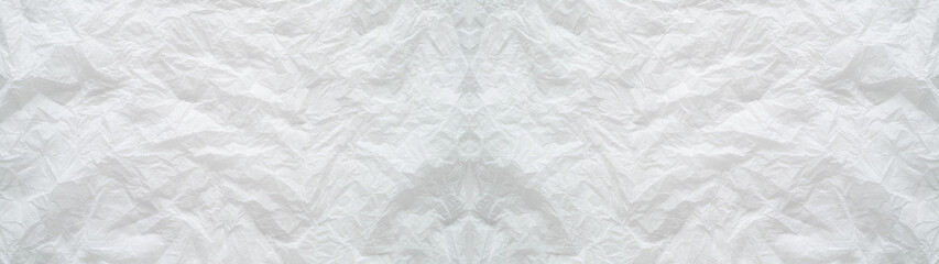 白いティッシュペーパーの皺のテクスチャー。薄い紙の横に長いパノラマの背景素材。