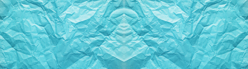 しわくちゃな青色の花紙のテクスチャー。横に長いパノラマの背景素材。