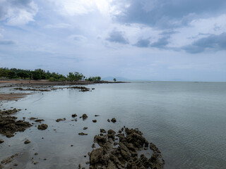 A panoramic view of the sea, trees and sky in southern Thailand.