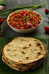 Whole-wheat  roti served with chickpeas curry, chana masla, - Indian vegetarian meal.