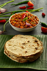 Healthy vegan meal, homemade chapathi, chapati served with chickpea curry, chana masla.and onion salad.