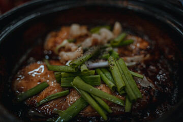 Close up Vietnamese Fish Simmered in Caramel Sauce. Delicious Vietnamese clay pot fish with sauce...