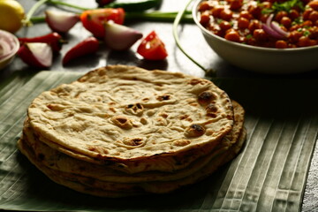 Healthy vegan meal, homemade chapathi, chapati served with chickpea curry, chana masla.and onion salad.