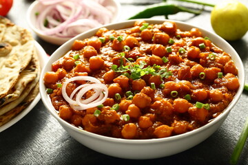 Indian street foods- spicy cooked chickpeas curry- chana masala.