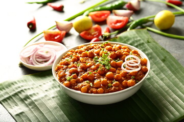 Indian street foods- spicy cooked chickpeas curry- chana masala.