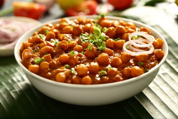 Chana masala- Indian traditional chickpeas curry with exotic spices and herbs.