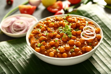 Chana masala- Indian traditional chickpeas curry with exotic spices and herbs.