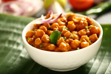 Bowl of delicious chickpeas curry, chana masala, Indian vegetable cooking recipes.