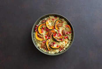 Bulgur with pumpkin, pomegranate and pecan nut. Healthy eating. Vegetarian food.