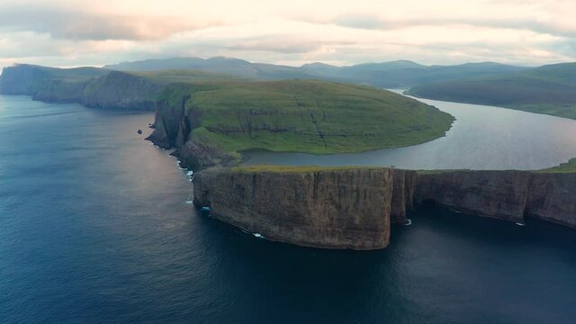 Sunrise at Sorvagsvatn or Leitisvatn lake at sunrise. Faroe Islands, aerial.