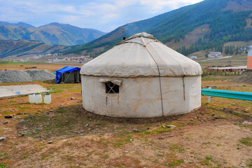 Mountain and forest, grassland scenery, yurt in xinjiang, China