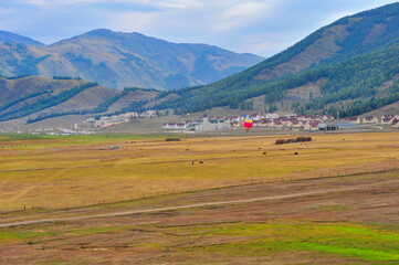 Obraz premium Mountain and forest, grassland scenery, yurt in xinjiang, China