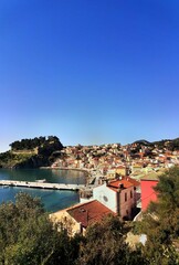 Obraz premium parga city greek tourist resort houses roofs sea , greece
