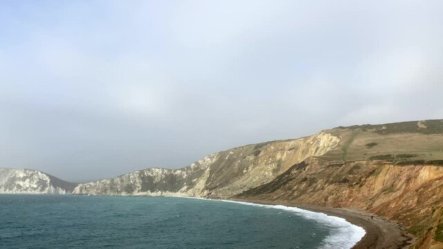 Beautiful aerial shot of chalk cliffs and headland on the coast of Dorset, England