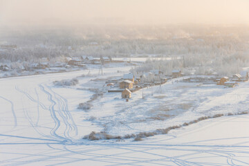 Winter landscape with snow. View from the hill to the Yakutsk city in the fog on a cold winter evening - 478262025