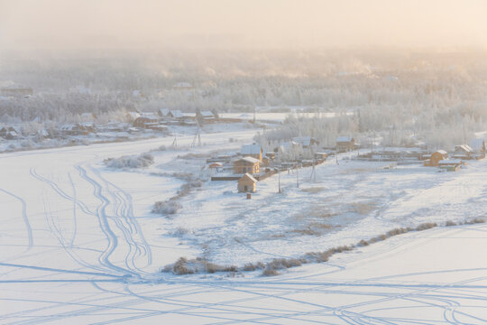 Winter landscape with snow. View from the hill to the Yakutsk city in the fog on a cold winter evening