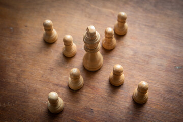Boss and leader concept. Followers on social media concept. Chess pieces on a wooden background