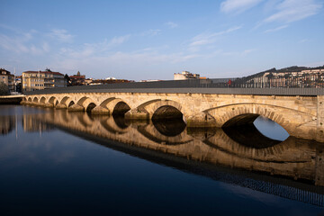 Fototapeta na wymiar Puente del Burgo, medieval bridge, built on a previous one of Roman origin, that crosses the Lerez river in the city of Pontevedra (Spain), on the way to the Portuguese Camino de Santiago
