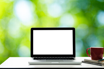 laptop with screen,nature background for light bokeh.	
