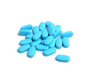 Blue pills, vitamins on a white background.