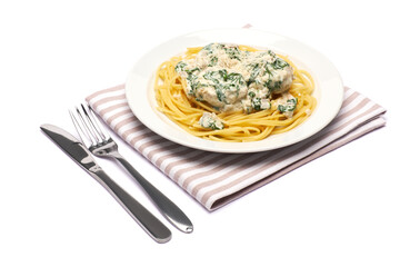 Portion of delicious meatballs with spinach in a creamy sauce and pasta