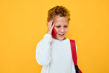joyful schoolboy use the phone education kids lifestyle isolated background