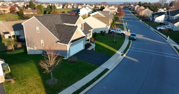 Aerial of homes in residential development in USA. American lifestyle establishing shot.
