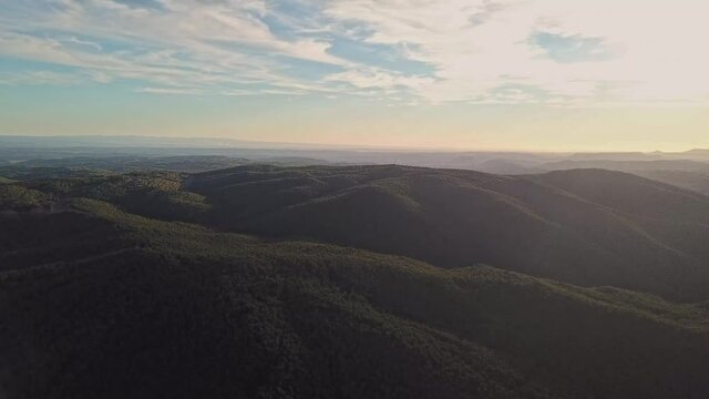 Aerial footage of a valley of mountains in Spain.