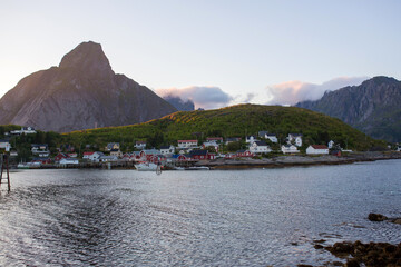 Scenic panorama view of norwegian beautiful nature and small fishing villages with typical rorbu wooden red cabins in Lofoten, Norway