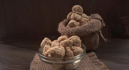 Raw soya chunks on dark background. Healthy, nutritious soybean meat, chunks isolated.Vegan food concept.
