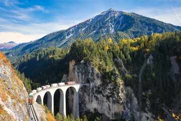 Train crossing Landwasser Viaduct (Landwasserviadukt), Graubunden, Switzerland, view from the vally...