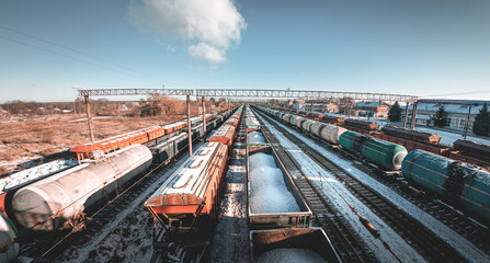 Freight trains from a height at the marshalling yard. Delivery of goods by freight train. Railroad cars at the station