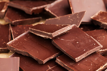 a chocolate bar broken into more pieces