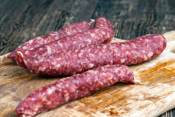 sliced sausage of dried meat with bacon