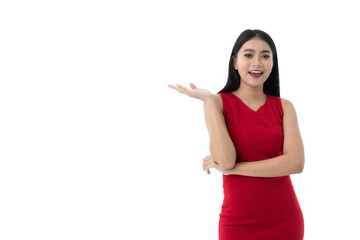 Beautiful young Asian woman in red dress is smiling, showing right hand for holding or showing something on palm with blank copy space with feels happy, isolated white background with clipping path. - 478270806