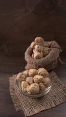 Raw soya chunks on dark background. Healthy, nutritious soybean meat, chunks isolated.Vegan food concept.
