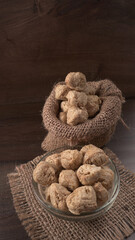 Raw soya chunks on dark background. Healthy, nutritious soybean meat, chunks isolated.Vegan food concept.
