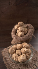 Raw soya chunks on dark background. Healthy, nutritious soybean meat, chunks isolated.Vegan food concept.
