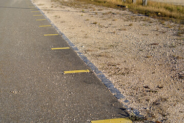 Close-up of empty outdoor car park at the airport on a sunny winter day. Photo taken December 31st, 2021, Zurich, Switzerland.