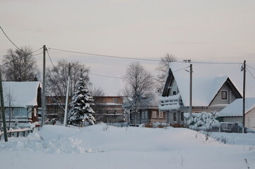 houses in the snow in the village in winter.