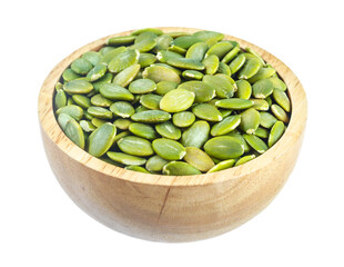 Pumpkin seeds green peeled in wooden bowl isolated on white background.