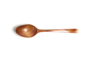 Wooden spoon on a white background top view.