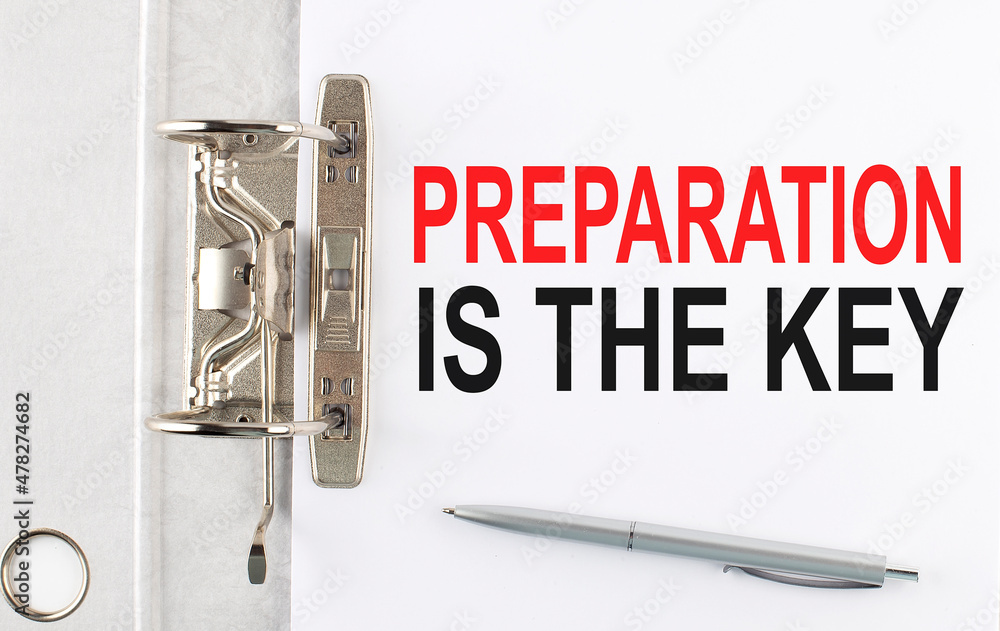 Poster preparation is the key text on the paper folder with pen. business concept